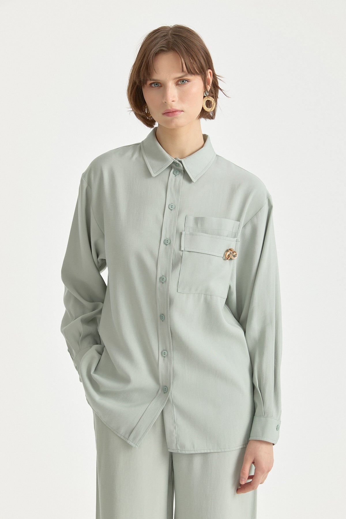 cep-detayli-lyocell-pantolon-tunik-takim-cagla-263253.jpg