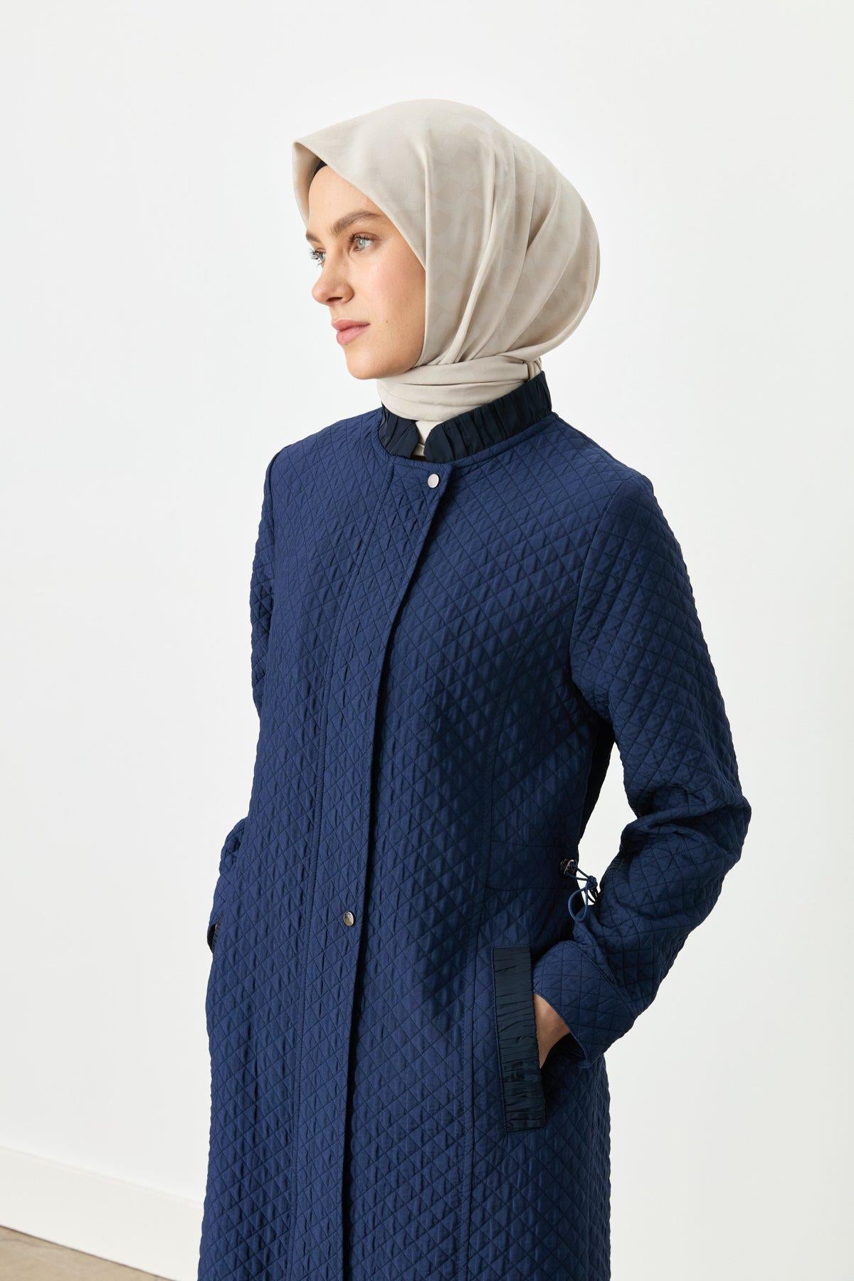 ince-kapitone-beli-buzgulu-kap-lacivert-252940.jpg