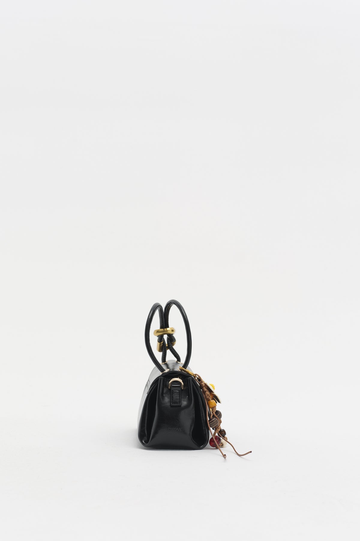 Black Cross-Body Bag with Flap and Charm Accessory