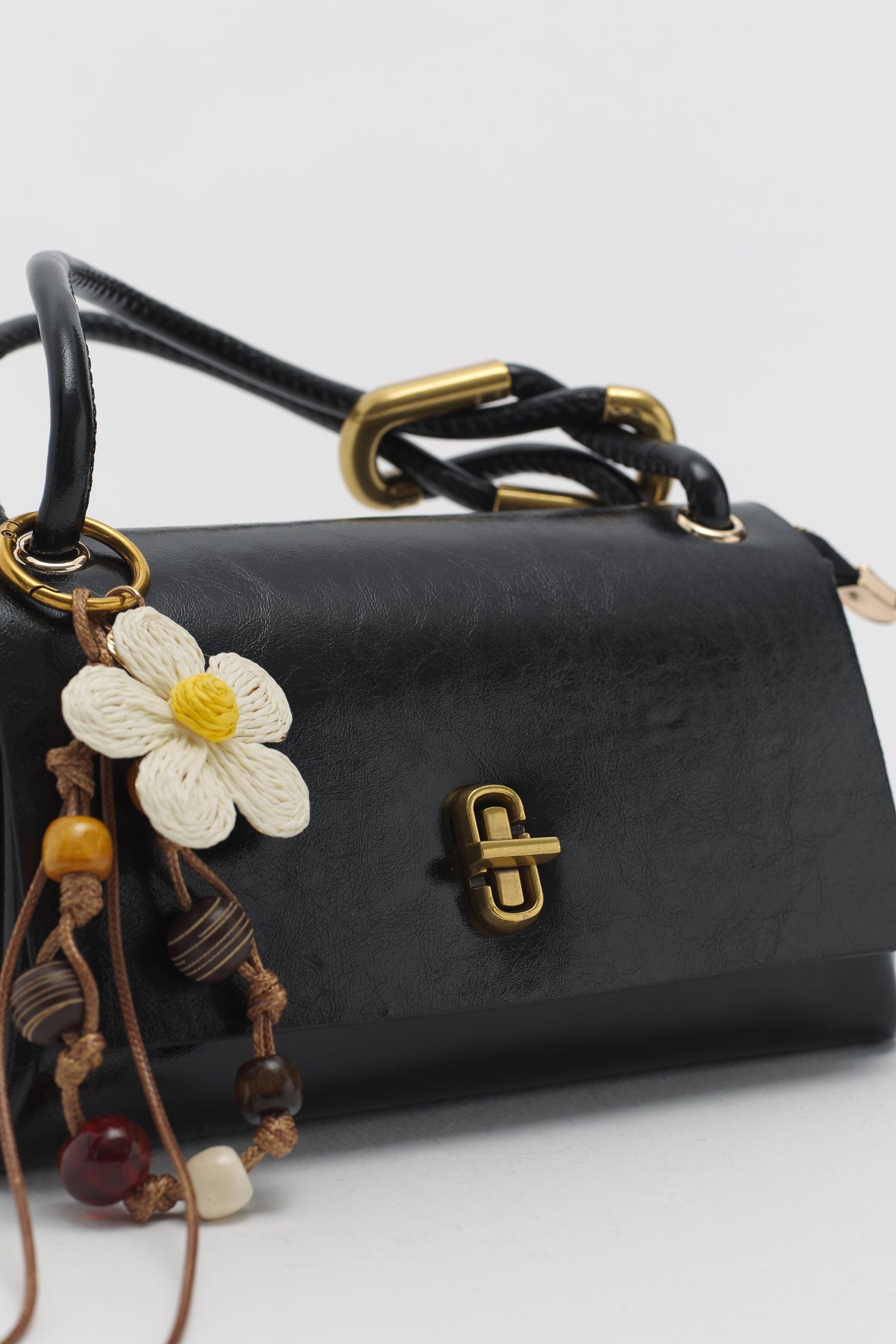 Black Cross-Body Bag with Flap and Charm Accessory